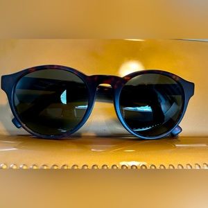 Coach Sunglasses with tortoiseshell colored frames and dark brown lens.